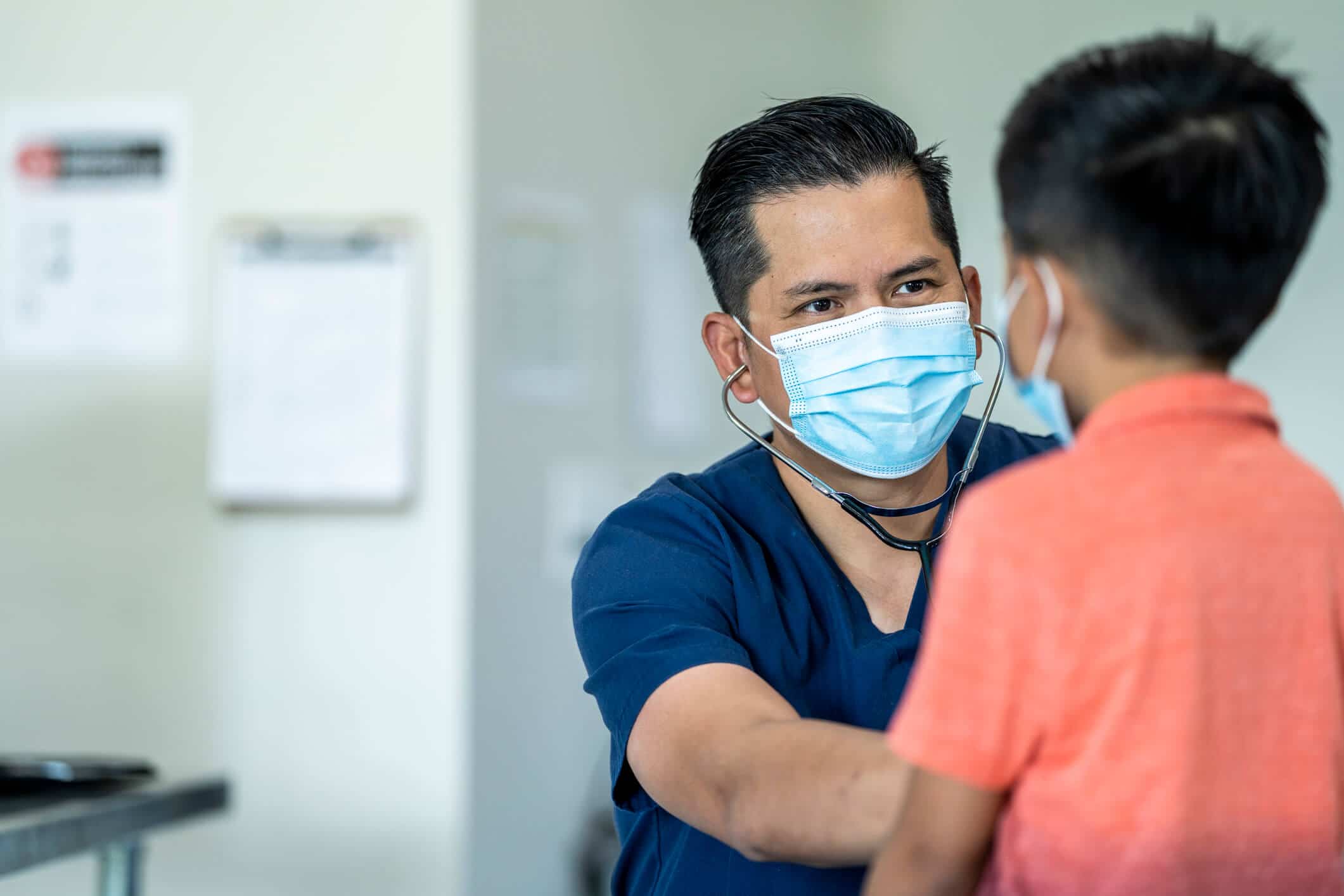 Doctor listening to the heartbeat of a child