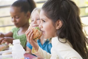 Kindergarten children eating lunch