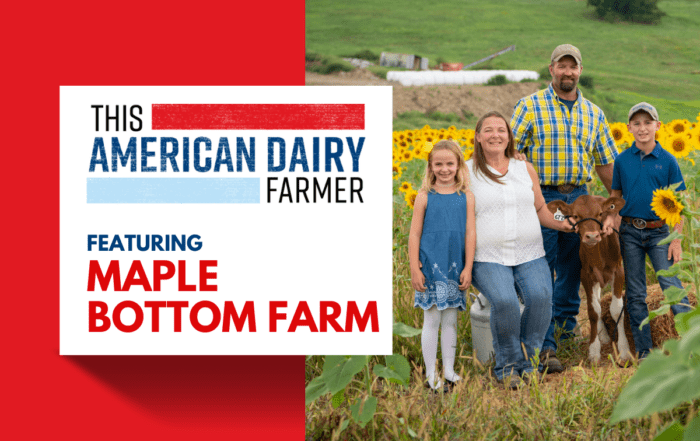 Members of a dairy farming family pose in a sunflower-filled field alongside a cow at Maple Bottom Farm.