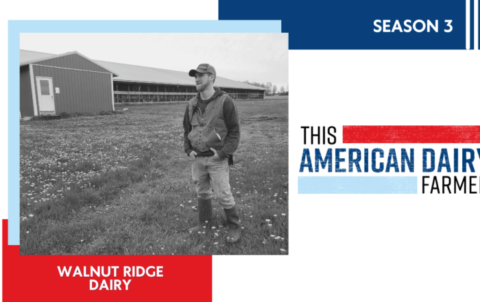 Dairy farmer Jake Palladino is standing in the farm field.